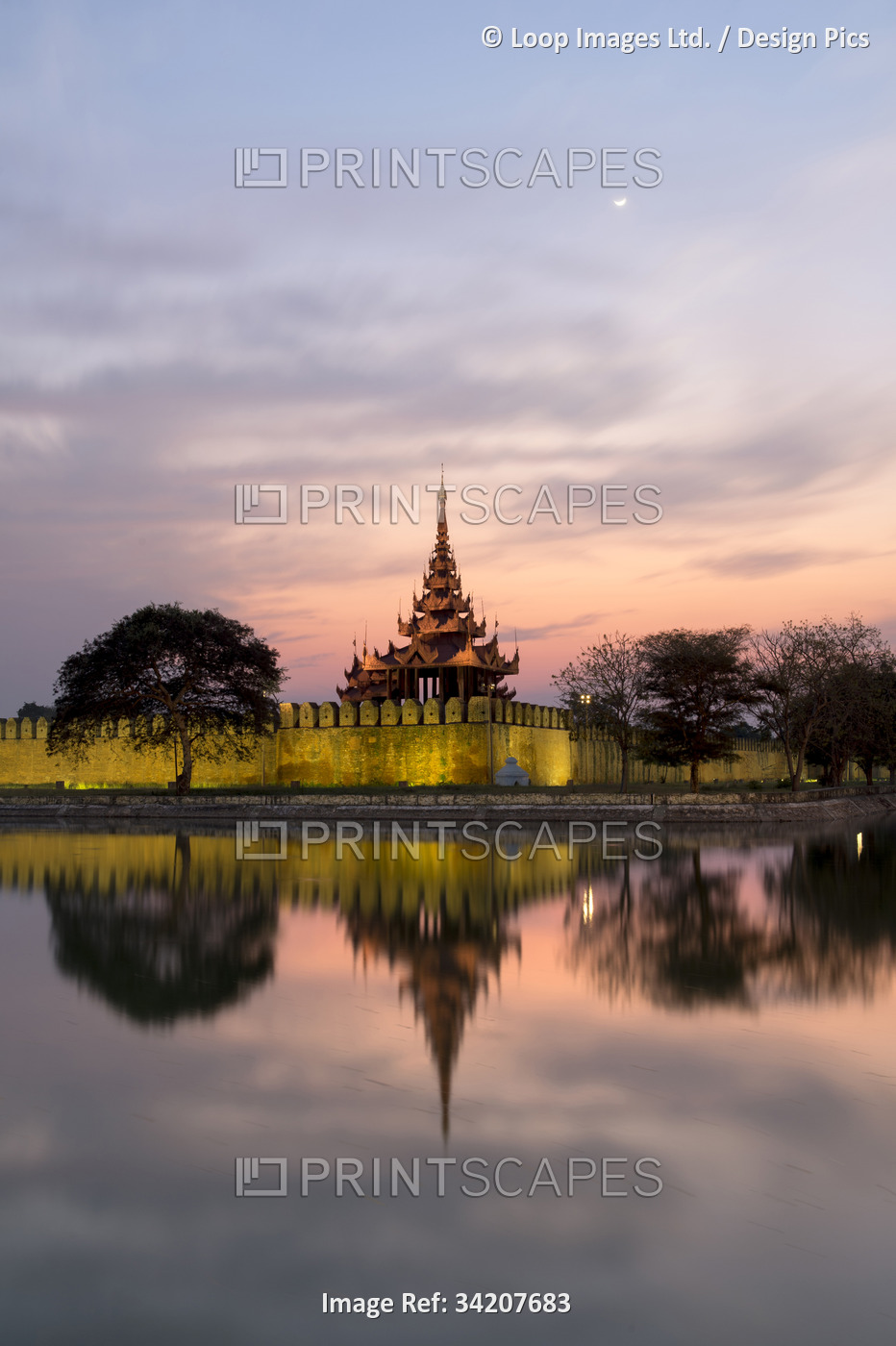The Royal Palace reflected at dusk in Mandalay.